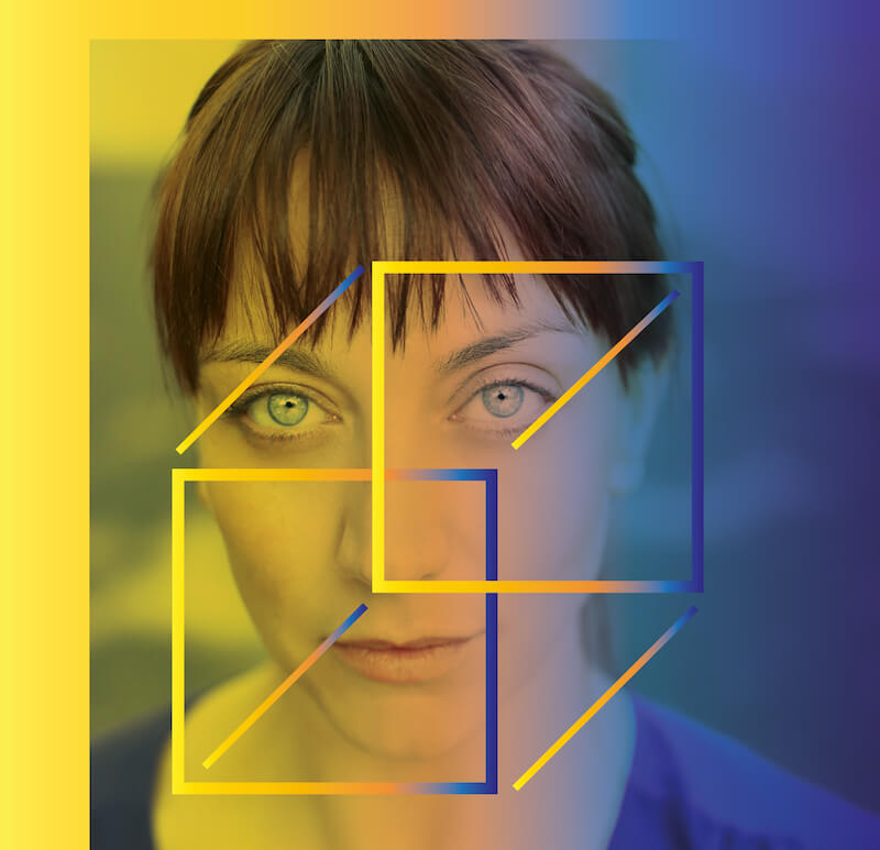 A woman directly looking at the camera, with a square cube outline over her face.